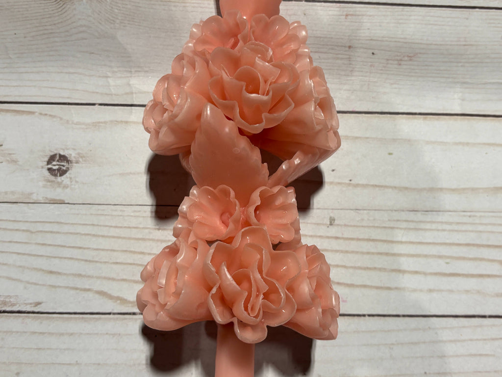 A light pink Rose Quartz Large Oaxaca Marigold Candle made of handmade beeswax, featuring two clusters of molded floral blossoms.