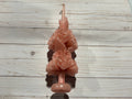 Rose Quartz Large Oaxaca Marigold Candle, a pale pink handmade pillar candle shaped like a stack of two marigold flower blooms.