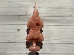 Rose Quartz Large Oaxaca Marigold Candle, a pale pink handmade pillar candle shaped like a stack of two marigold flower blooms.
