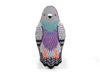 Stuffed pigeon from a Pigeon - Embroidery Kit, featuring gray, teal, and purple embroidered plumage and orange feet.