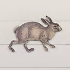 The Ragon House POSEABLE METAL BUNNY features a vintage-style rabbit in mid-run, detailed with visible joints for movable parts, mounted on a white wooden panel with half-circle hangers.