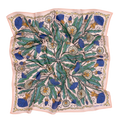 The 34" Dandy Wild Rag Bandana by Handker Bandanas is a square silk scarf with a botanical print of dandelions, green leaves, and blue thistles on pale pink, bordered with wavy lines and inspired by classic bandanas. Fabric has a slightly rumpled look.