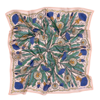 The 34" Dandy Wild Rag Bandana by Handker Bandanas is a square silk scarf with a botanical print of dandelions, green leaves, and blue thistles on pale pink, bordered with wavy lines and inspired by classic bandanas. Fabric has a slightly rumpled look.