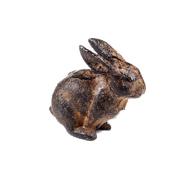 The Vagabond Vintage Small Cast Iron Rabbit is a rustic, dark brown sculpture featuring an upright rabbit with ears pointed back, shown in side profile against a white background.