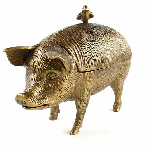 The Pig with Bird Storage Box by Vagabond Vintage features an antiqued brass finish, a pig shape with a hinged lid, and a bird figurine perched on top for decorative storage.