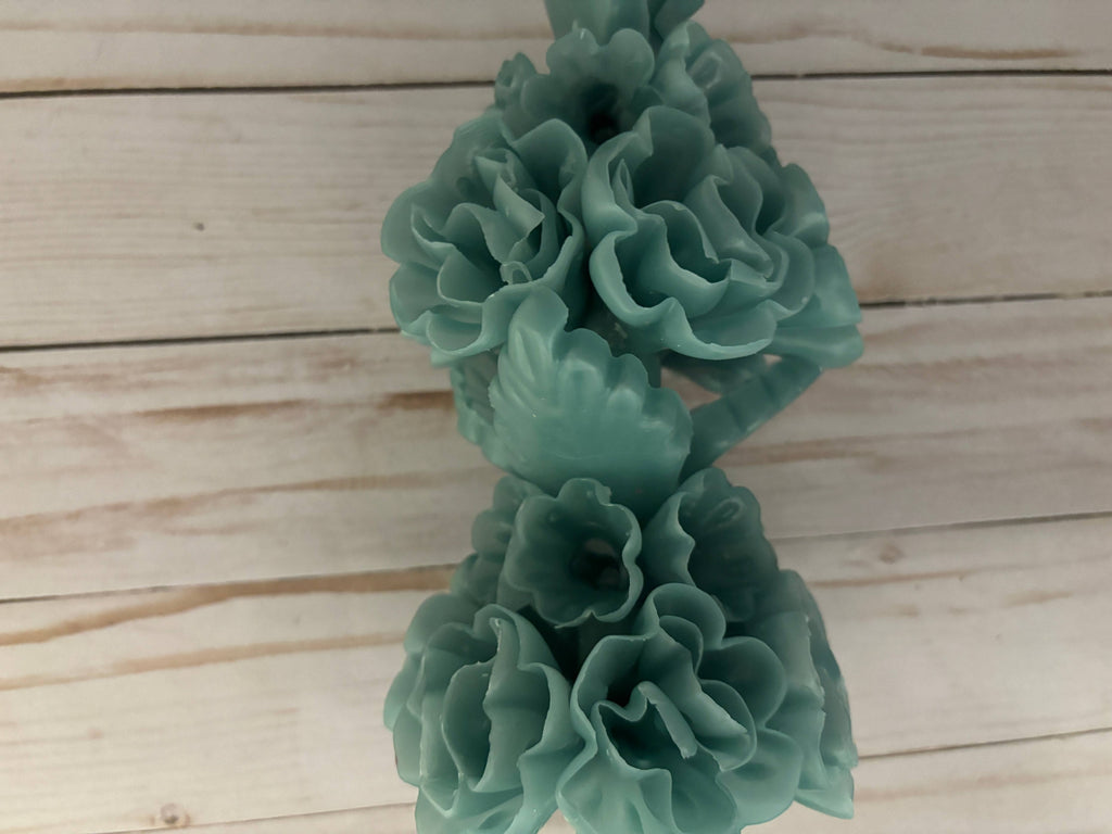 Beeswax Large Sage Oaxaca Marigold candle, handmade in a sage green color and shaped like a cluster of flowers.