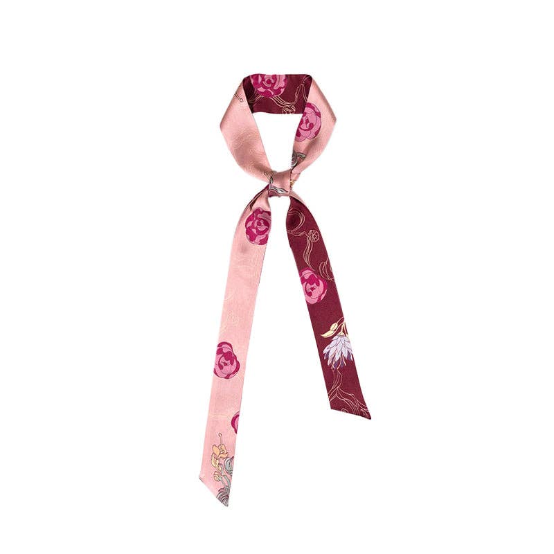 The Lost Pattern NYC Silk Skinny Scarf - Ruby Red is a narrow mulberry silk scarf with pink and burgundy floral sections, perfect tied in a loose knot or styled as a chic hair accessory or stylish headband.